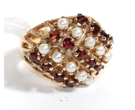 A 9 carat gold ruby and seed pearl set ring, finger size O.  Gross weight - 8.62 grams. 