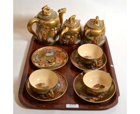 A Japanese Satsuma part tea service decorated with sages, circa 1890/1900