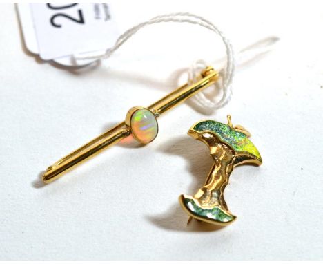 A 9 carat gold opal bar brooch, length 5cm and a 9 carat gold enamelled bitten apple brooch, measures 3cm by 1.75cm (2).  Bar