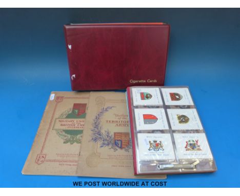 Four albums of military related c1930 largely Players cigarette cards, including Territorial Army Uniforms, Arms of British E