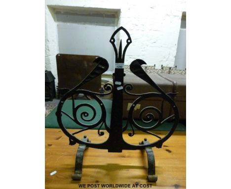 A wrought iron fire screen, log basket and a metal lamp fitting