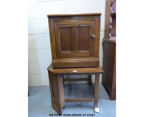 An Ercol corner unit together with a matching cupboard 