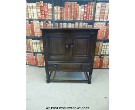 A small Ercol dresser with cupboard above drawer (W79 x D44 x H88cm) 