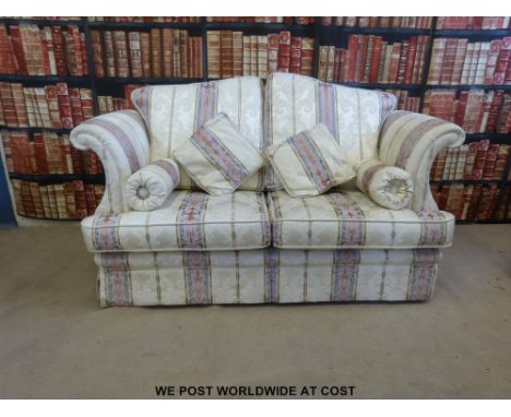 A two seat sofa with scroll arms 