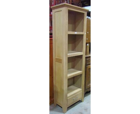 A good quality contemporary light oak freestanding shelving unit with open fixed shelves and drawer to base, 62 cm wide x 36 