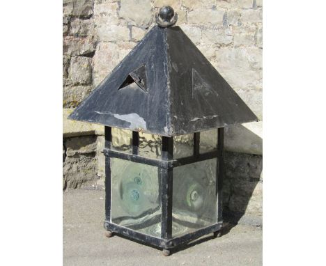 A large vintage hanging lantern of square form with pitched roof and bulls eye light green glazed panels (believed to be recl