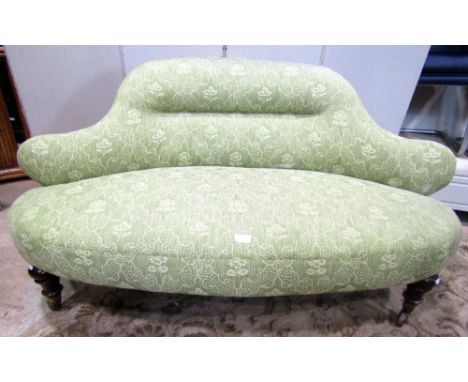 An unusual Victorian parlour/drawing room sofa, with shaped outline, and green ground floral patterned upholstered finish, ra