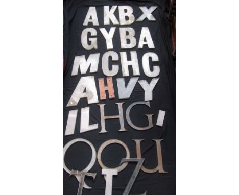 A collection of vintage industrial cast metal stencils/lettering