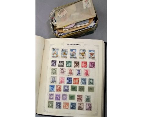 A Hermes stamp album containing a quantity of British and worldwide stamps together with a tin box containing a quantity of u