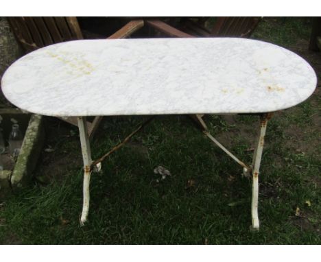 A vintage cast iron pub/garden table, the cream painted base with swept supports beneath an associated marble top, 120 cm lon