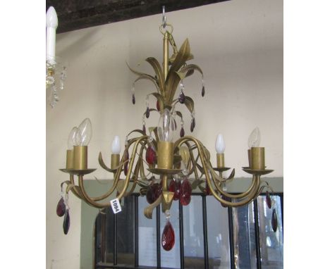 A contemporary cast light metal hanging ceiling light/electrolier with eight scrolling branches with leaf detail, ruby colour
