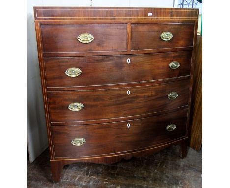 A Regency mahogany caddy top chest of three long and two short drawers with bow fronted outline, string banded and other inla