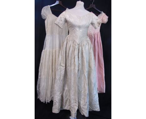 Eight vintage garments including a pink silk Harvey Nichols house coat, Victorian full length silk gown, bridal wear, ivory s