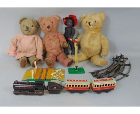 Vintage toy collection including three teddy bears, all with stitched noses and articulating limbs, a black cloth doll with r