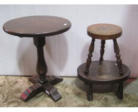 A good quality Old English style oak oval drop leaf occasional table with swivel top raised on turned supports and stretchers