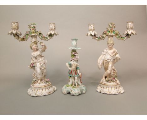 A pair of 19th century continental two branch candelabra with applied of male and female harvester and floral encrusted decor