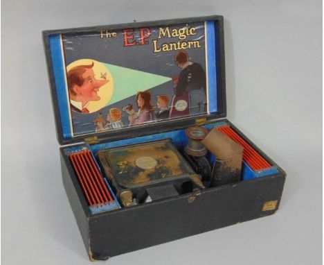 'The E.P. Magic Lantern' tin plate projector complete in original box with twelve coloured glass slides