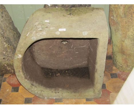 A good weathered natural stone D shaped trough, 58 cm wide x 28 cm high