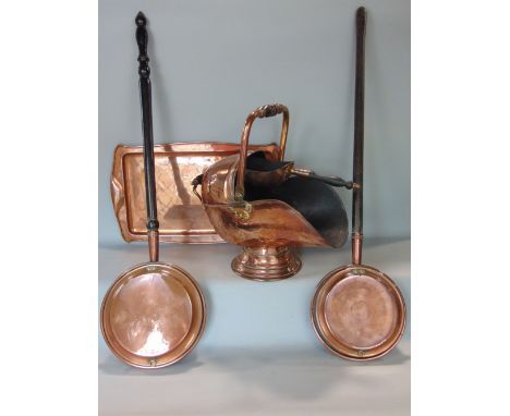 A collection of copper ware including a rectangular copper serving tray from the Keswick School of Arts and Crafts Movement, 