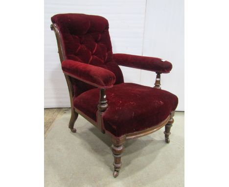 A Victorian drawing room or library chair, with polished mahogany framework and original ruby red upholstered velvet finish w