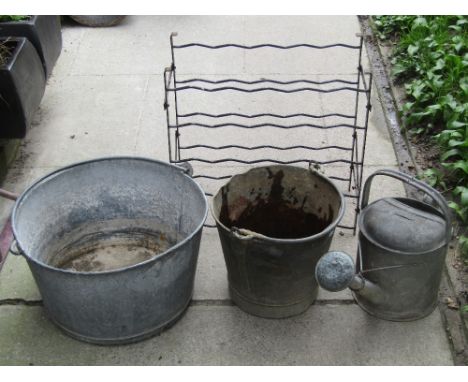 Two vintage galvanised buckets of varying sizes, further galvanised watering can with rose, and a small wine rack