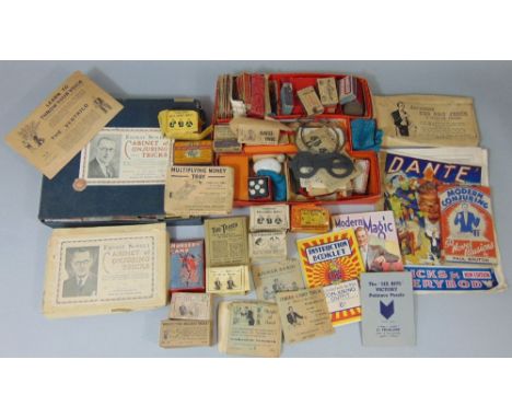 Collection of magicians tricks and puzzles including an Ernest Sewell box of conjuring tricks and E &amp; S boxed novelty tri