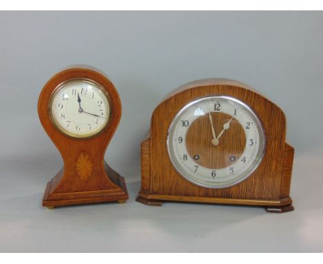 An oak balloon head mantle clock, 24 cm high, key, together  with a Garrard mantle clock, key and pendulum