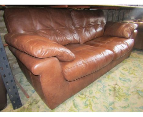 Contemporary G Plan mid-brown leather upholstered two/three seat sofa, with shaped outline and loose cushions