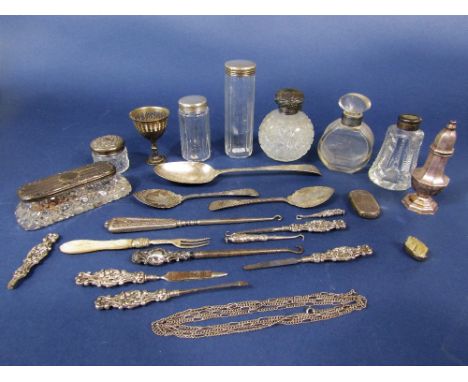 A box containing a collection of various silver items to include various silver topped glass bottles, silver Old English tabl