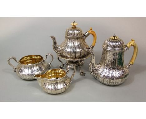 Impressive Victorian silver four piece tea service comprising teapot/spirit kettle, water pot, milk jug and sucrier, the milk