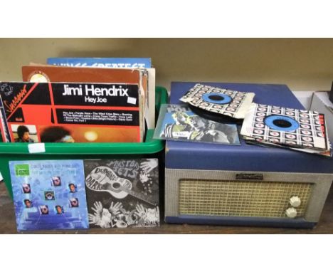 A blue Dansette record player, a quantity of vinyl LPs and a small number of 45rpm singles including a blue vinyl version of 
