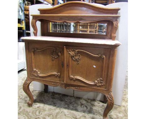 A medium to light oak side cupboard/buffet, the recessed raised and arched moulded back supporting a shelf and inset rectangu