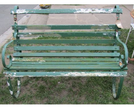 A vintage sprung steel two seat garden bench with green painted timber lathes, 4ft long