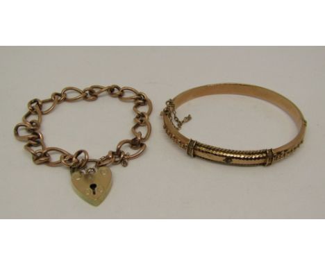 Two 9ct rose gold bracelets; a hinged Etruscan style bangle with applied rope twist edging (stone vacant) and a curb link exa