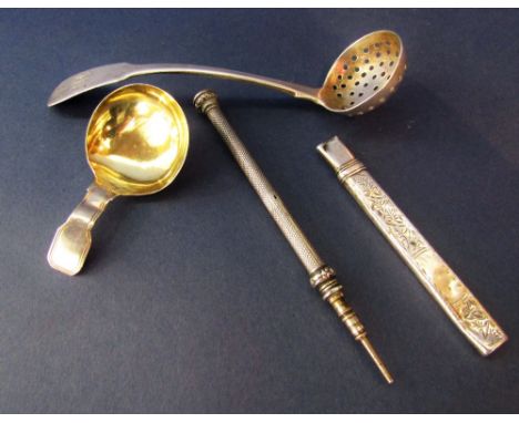 A small collection of bijouterie silver to include silver caddy spoon, sifter spoon, propelling pencil and further cased penc