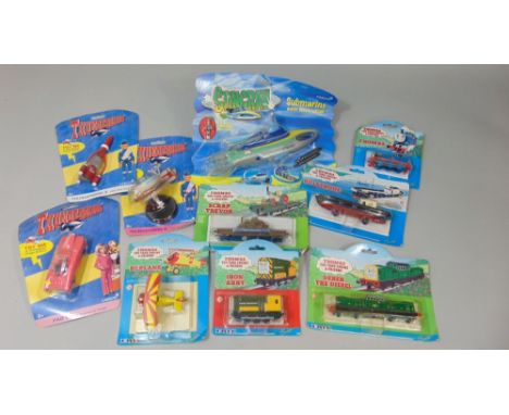 Box of collectable Carlton and Britt toys in original packaging including Stingray submarine, Thunderbirds 3,5 and Fab 1, and