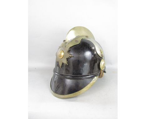 A 19th century Swedish fireman's helmet with applied brass mounts