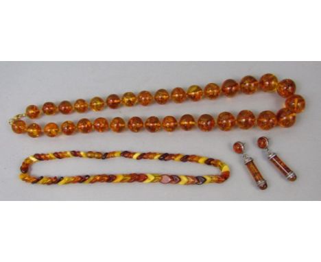 Amber jewellery comprising a substantial globular bead necklace, together with a further vari colour bead necklace and a pair