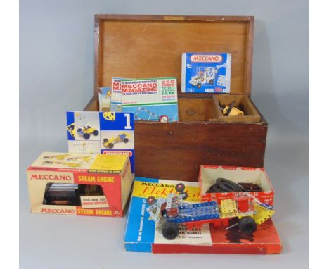 Wooden trunk containing a collection of Meccano including steam engine, clockwork &amp; electric motors, Elektrikit and 1960s