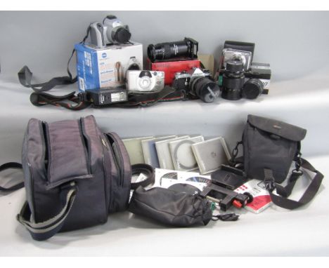 A collection of photographic equipment including a Pentax ME ASAHI, 35mm Electronic SLR camera 1976-79, fitted with a Tamron 