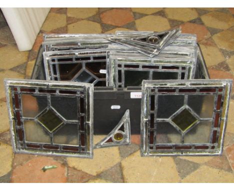 22 small stained leaded light panels, 22cm square approx, plus a few corner pieces, (17 in good order, the others for spares 