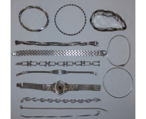 Various silver bracelets to include a garnet bracelet