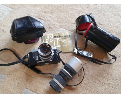 A Nikkormat FTN camera with 28 mm and zoom lenses, cased and a Yashica Atoron camera, using Minox spy camera film.