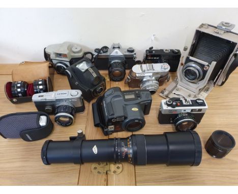 A collection of cameras, to include an Olympus Pen FT camera with lens,&nbsp;a plate camera with Linhof badge and an Ensign c