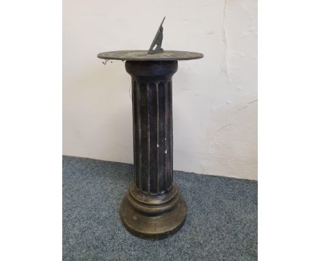 A painted concrete pedestal with metal sundial, inscribed 'Grow old along with me, the best is yet to come.', height 68 cm.