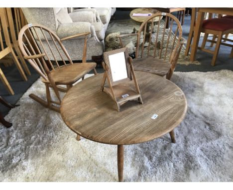 Ercol, circa 1954 - 1976 blue label, a beech and elm Windsor back child's rocking armchair, another matching armchair, a circ