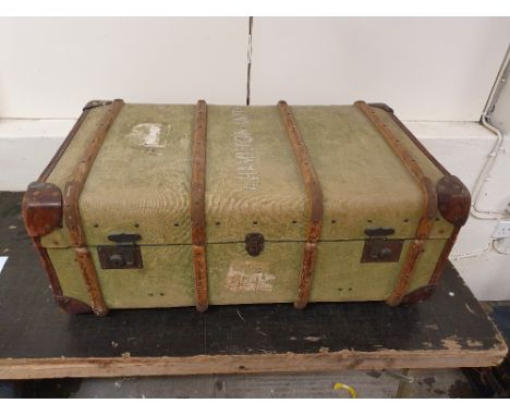 A wood bound green canvas travelling trunk, named A. Hamilton-Smith with period railway labels, and another trunk (2).