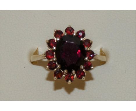 A 9ct gold garnet cluster ring size O 1/2, 3.5g