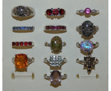 A collection of 13 gem set silver rings