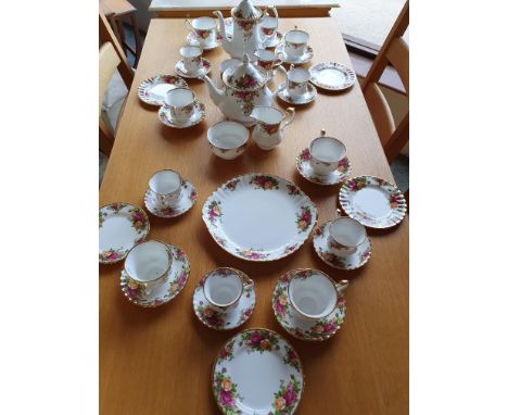 A Royal Albert Country Roses tea and coffee service for six place settings, comprising tea pot, sugar bowl, milk jug, coffee 